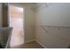 Walk-in closet with ample shelving and storage space, next to bathroom at 5587 Trace Views Dr, Norcross, GA 30071