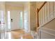 Bright foyer showcasing hardwood floors, a staircase, and a modern front door with side windows at 5587 Trace Views Dr, Norcross, GA 30071