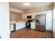 Modern kitchen featuring white cabinets, stainless steel appliances, and wood flooring at 5587 Trace Views Dr, Norcross, GA 30071