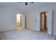 Spacious main bedroom with a ceiling fan, ensuite bathroom, and multiple closets at 5587 Trace Views Dr, Norcross, GA 30071