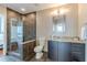Modern bathroom features a glass-enclosed shower and granite countertop vanity at 1080 Ne Peachtree Ne St # 2802, Atlanta, GA 30309