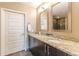 Dual sink vanity with granite countertops and a walk-in shower at 1080 Ne Peachtree Ne St # 2802, Atlanta, GA 30309