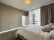 Bedroom with city views, hardwood floors, and neutral paint at 1080 Ne Peachtree Ne St # 2802, Atlanta, GA 30309