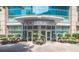 The front entrance to 1010 Midtown featuring well-maintained landscaping at 1080 Ne Peachtree Ne St # 2802, Atlanta, GA 30309