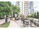 Outdoor courtyard with seating and lush landscaping at 1080 Ne Peachtree Ne St # 2802, Atlanta, GA 30309
