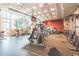 Well-equipped gym with treadmills, weights, and large windows for natural light at 1080 Ne Peachtree Ne St # 2802, Atlanta, GA 30309