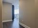 View of the kitchen from the hallway with hardwood floors at 1080 Ne Peachtree Ne St # 2802, Atlanta, GA 30309