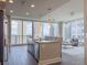 Contemporary kitchen and living space with floor-to-ceiling windows and city views at 1080 Ne Peachtree Ne St # 2802, Atlanta, GA 30309