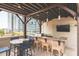 Outdoor kitchen with bar seating, a built in grill, and city views at 1080 Ne Peachtree Ne St # 2802, Atlanta, GA 30309