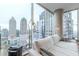 Living room featuring floor-to-ceiling windows offering panoramic city views at 1080 Ne Peachtree Ne St # 2802, Atlanta, GA 30309