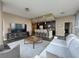 Spacious living area with open kitchen, hardwood floors, and contemporary furnishings at 1080 Ne Peachtree Ne St # 2802, Atlanta, GA 30309