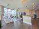 Open-concept living and dining area with floor-to-ceiling windows and hardwood floors at 1080 Ne Peachtree Ne St # 2802, Atlanta, GA 30309