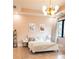 Bright bedroom with a decorative light fixture, modern style, and comfortable bedding at 3681 Hamilton Mill Rd, Buford, GA 30519