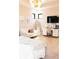 Bright bedroom with a desk area, modern light fixture, and comfortable seating at 3681 Hamilton Mill Rd, Buford, GA 30519