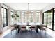 Bright dining room featuring a large table, modern chandelier, and expansive windows at 3681 Hamilton Mill Rd, Buford, GA 30519