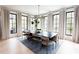 Bright dining room features stylish light fixture, large windows, and contemporary furnishings at 3681 Hamilton Mill Rd, Buford, GA 30519