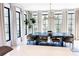 Bright dining room features stylish light fixture, large windows, and contemporary furnishings at 3681 Hamilton Mill Rd, Buford, GA 30519