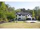 Stunning modern two-story home with manicured lawn and ample greenery at 3681 Hamilton Mill Rd, Buford, GA 30519
