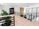 Bright hallway with black metal railings, a decorative plant, and modern finishes, adding a touch of elegance at 3681 Hamilton Mill Rd, Buford, GA 30519
