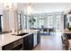 Modern kitchen featuring white countertops, stainless steel appliances, and views of the dining area at 3681 Hamilton Mill Rd, Buford, GA 30519