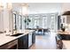 Modern kitchen featuring white countertops, stainless steel appliances, and views of the dining area at 3681 Hamilton Mill Rd, Buford, GA 30519