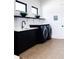 Laundry room with cabinetry, sink, and modern appliances at 3681 Hamilton Mill Rd, Buford, GA 30519