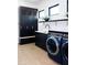 Laundry room with cabinetry, sink, and modern appliances at 3681 Hamilton Mill Rd, Buford, GA 30519