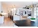 Bright, open-concept kitchen and living room with modern furnishings and hardwood floors at 3681 Hamilton Mill Rd, Buford, GA 30519