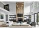 Open-concept living area boasts high ceilings and a modern fireplace at 3681 Hamilton Mill Rd, Buford, GA 30519