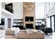 Bright living area with high ceiling, modern decor, and open staircase to the second floor at 3681 Hamilton Mill Rd, Buford, GA 30519