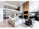 Open-concept living room with soaring ceilings, modern lighting, and stylish decor at 3681 Hamilton Mill Rd, Buford, GA 30519