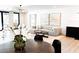 Open concept living space with elegant furniture and a contemporary design, bright natural light, and modern finishes at 3681 Hamilton Mill Rd, Buford, GA 30519