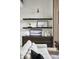 Stylish living room with sleek shelving and decorative art at 3681 Hamilton Mill Rd, Buford, GA 30519