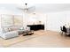 Bright living room featuring a modern couch, unique lighting, and a stylish dry bar area at 3681 Hamilton Mill Rd, Buford, GA 30519