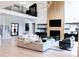 Bright living area with high ceiling, modern decor, and open staircase to the second floor at 3681 Hamilton Mill Rd, Buford, GA 30519