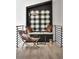 Cozy loft featuring a built-in nook with plaid accents, creating a stylish and inviting reading or relaxation spot at 3681 Hamilton Mill Rd, Buford, GA 30519