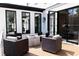Stylish outdoor patio with fire table and comfortable seating; a perfect spot for relaxation and gatherings at 3681 Hamilton Mill Rd, Buford, GA 30519