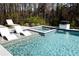 Inviting pool with integrated jacuzzi, sun loungers and water feature; perfect for relaxing in style at 3681 Hamilton Mill Rd, Buford, GA 30519