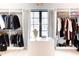 Spacious walk-in closet with custom shelving, hanging racks, and a central island at 3681 Hamilton Mill Rd, Buford, GA 30519