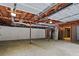 Unfinished basement with concrete floors, exposed ductwork, and partial walls at 641 Charing Cross Dr, Marietta, GA 30066