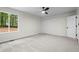 Spacious bedroom with a ceiling fan, neutral carpet, ample natural light, and a closet at 641 Charing Cross Dr, Marietta, GA 30066