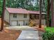 Charming ranch-style home featuring a two-car garage, stone accents, and a welcoming front porch at 641 Charing Cross Dr, Marietta, GA 30066