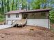 Charming two-story home boasts a welcoming front porch and a two-car garage at 641 Charing Cross Dr, Marietta, GA 30066