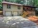 Charming ranch-style home featuring a two-car garage, stone accents, and a welcoming front porch at 641 Charing Cross Dr, Marietta, GA 30066