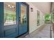 Stylish front door featuring glass panels and covered porch at 641 Charing Cross Dr, Marietta, GA 30066