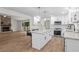 Bright white kitchen featuring stainless appliances and a center island, with an open floor plan at 641 Charing Cross Dr, Marietta, GA 30066