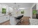 A sleek, updated kitchen featuring a center island, granite counters, and a breakfast bar at 641 Charing Cross Dr, Marietta, GA 30066