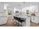 Modern kitchen features a center island with seating and stainless steel appliances at 641 Charing Cross Dr, Marietta, GA 30066