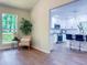 Bright living room adjacent to a modern white kitchen with stainless steel appliances at 641 Charing Cross Dr, Marietta, GA 30066
