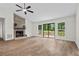Cozy living room featuring a stone fireplace, vaulted ceilings, and a sliding glass door at 641 Charing Cross Dr, Marietta, GA 30066